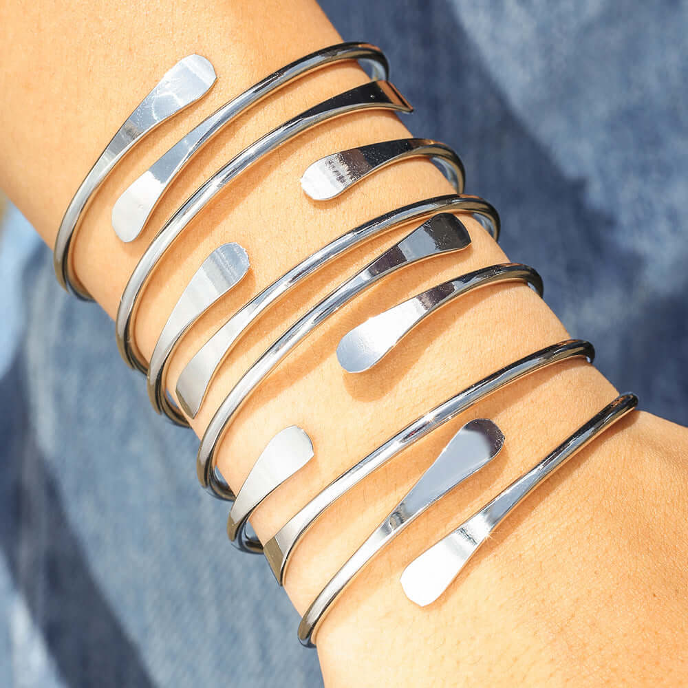 A Set of Six Gold or White Open Alloy Bracelet