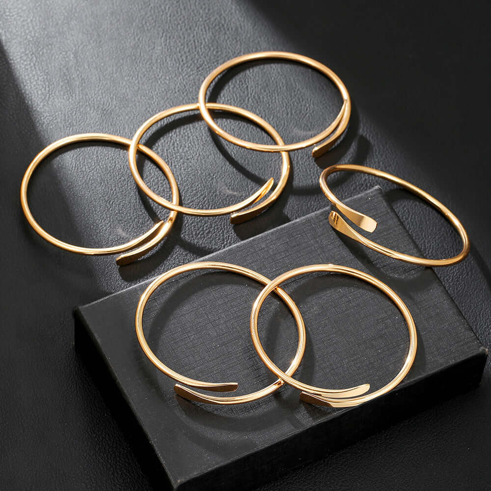 A Set of Six Gold or White Open Alloy Bracelet